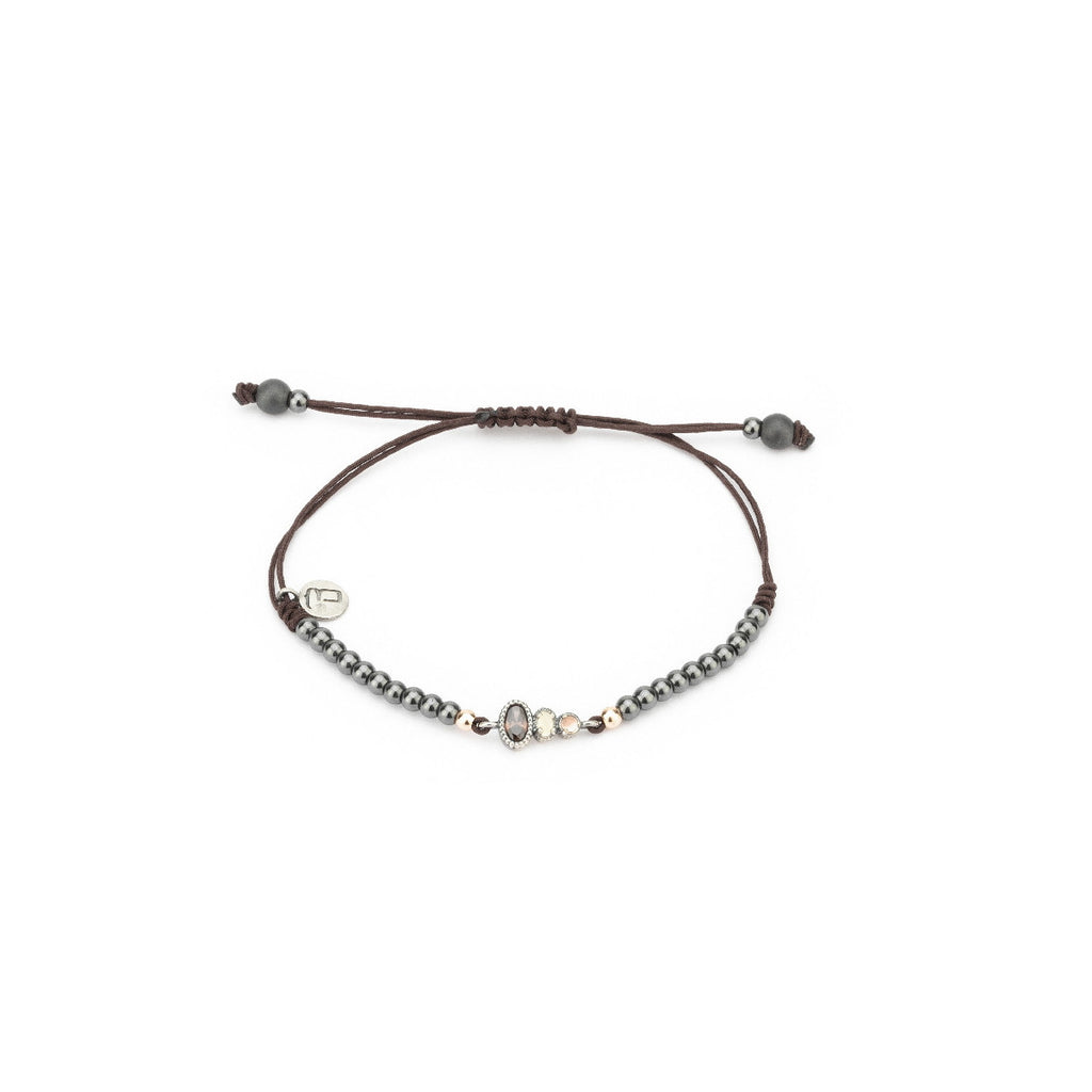 Pulsera de plata y macramé con ojo de gato